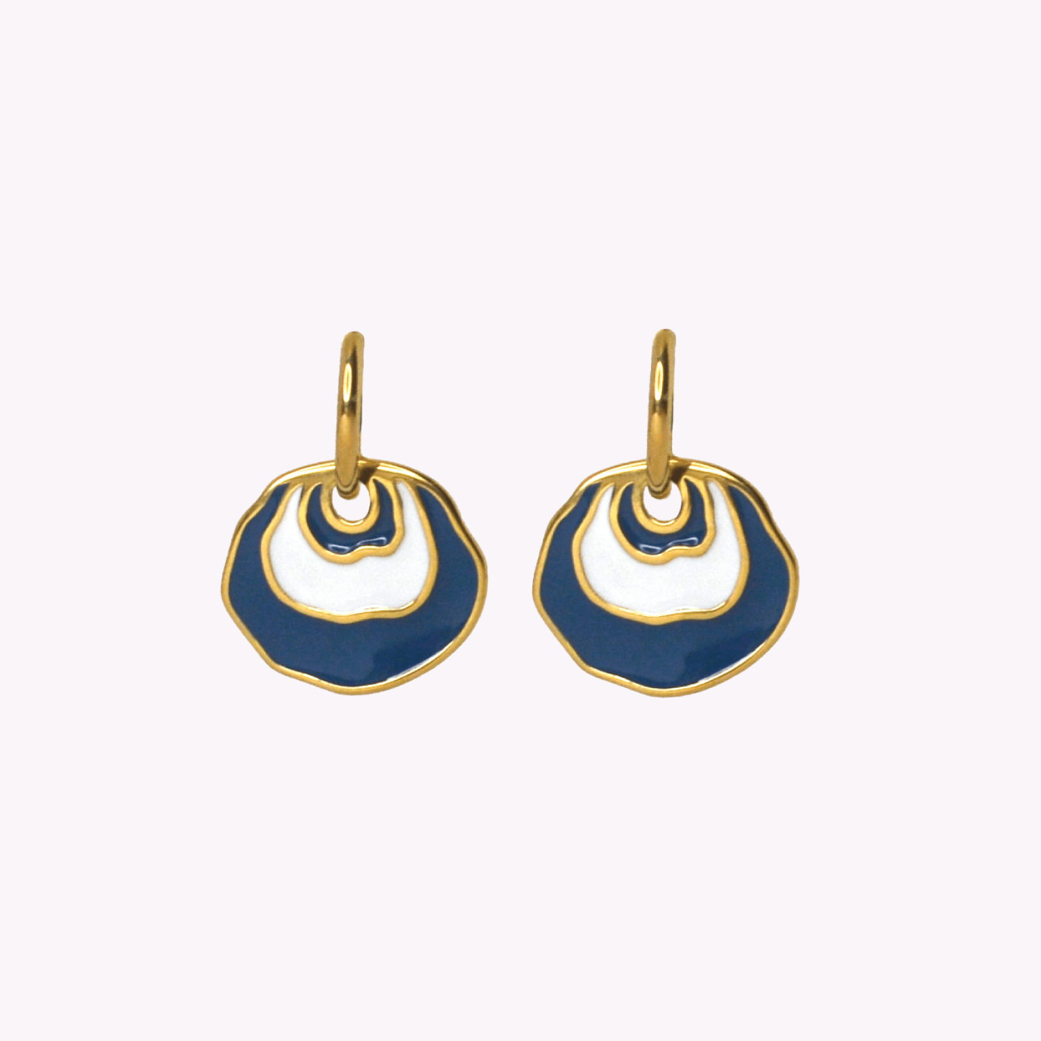 A pair of gold-tone dangle earrings with organic, wavy openwork circular shapes filled with royal blue and white enamel, shown against a plain off-white background. Inspired by a Jingle seashell.
