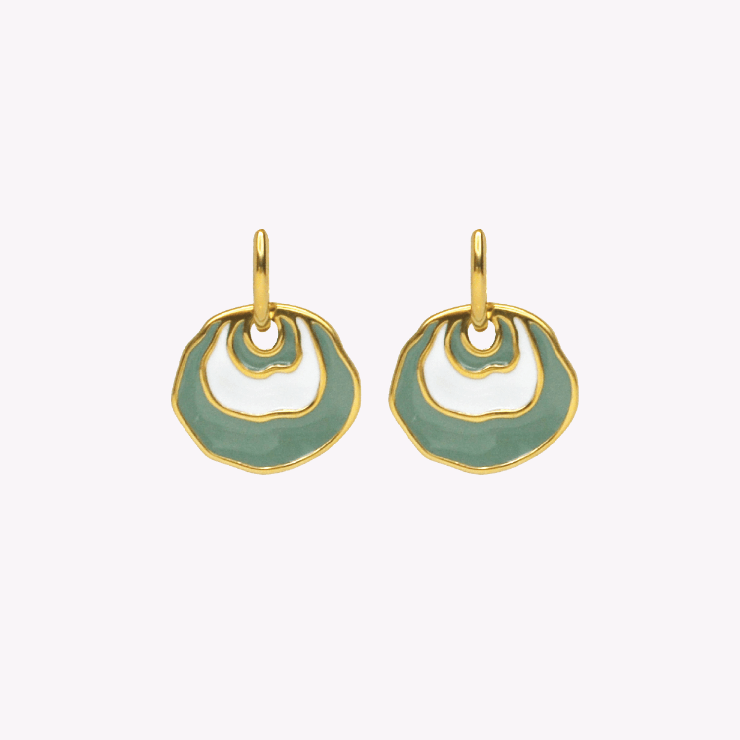 A pair of gold-tone dangle earrings with organic, wavy openwork circular shapes filled with Sea Foam Green and white enamel, shown against a plain off-white background. Inspired by a Jingle seashell.